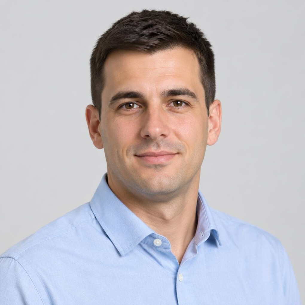 Studio portrait of a Croatian man with short dark hair